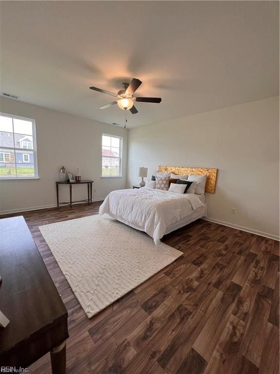 bedroom featuring ceiling fan and dark wood-type flooring