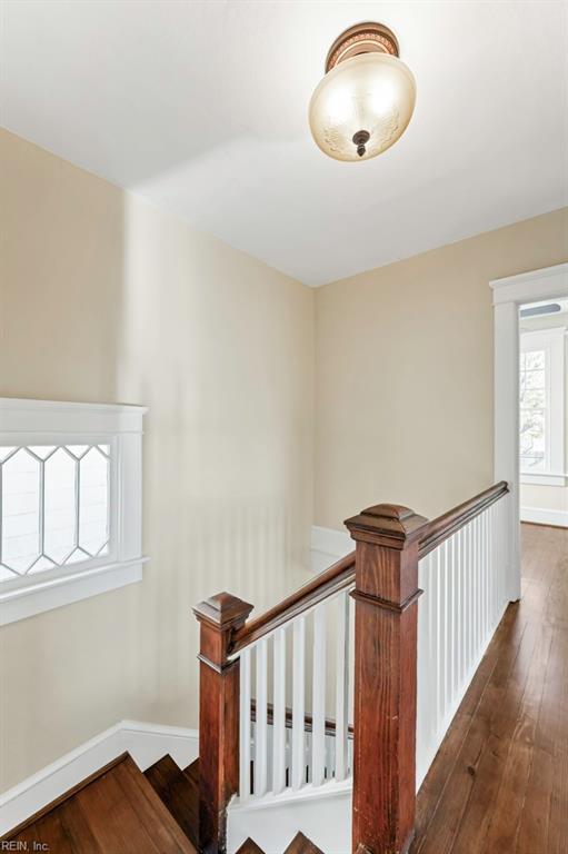 stairs with hardwood / wood-style flooring