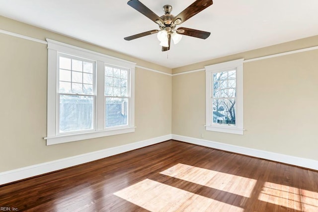 unfurnished room with hardwood / wood-style flooring, ceiling fan, and a wealth of natural light