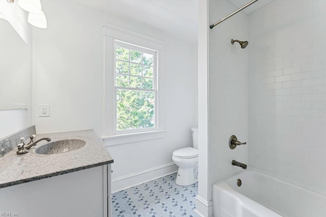 full bathroom featuring tile patterned flooring, vanity, toilet, and tiled shower / bath