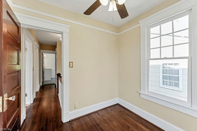 unfurnished room with dark hardwood / wood-style floors and ceiling fan