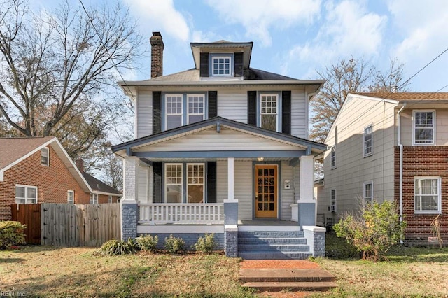 view of front of house featuring a front lawn and a porch