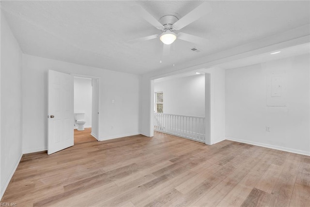 spare room featuring ceiling fan and light hardwood / wood-style floors