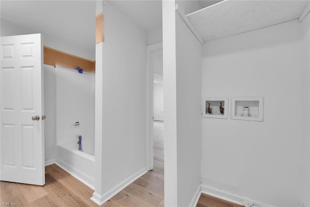 washroom featuring hookup for a washing machine and wood-type flooring