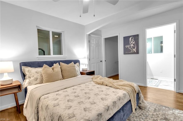 bedroom featuring dark hardwood / wood-style floors and ceiling fan