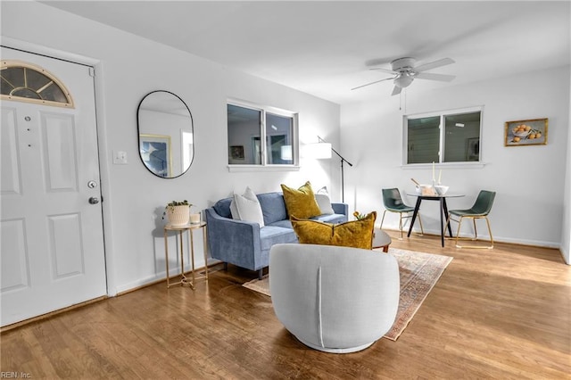 living room with ceiling fan and hardwood / wood-style floors