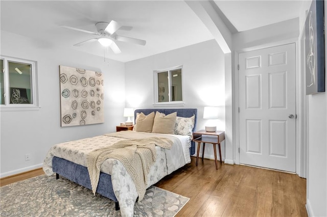 bedroom featuring ceiling fan and wood-type flooring