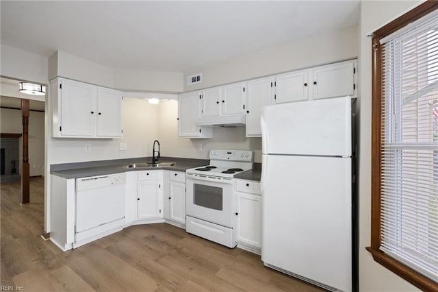 kitchen featuring white cabinets, light wood-type flooring, white appliances, and sink