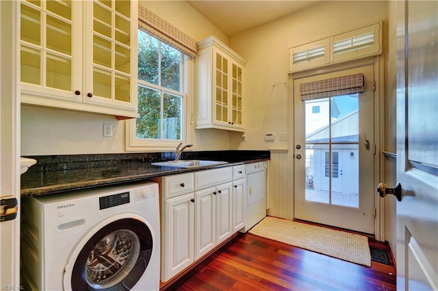 laundry area featuring a wealth of natural light, sink, washer / clothes dryer, and dark wood-type flooring