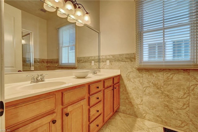 bathroom featuring tile patterned floors, vanity, and tile walls