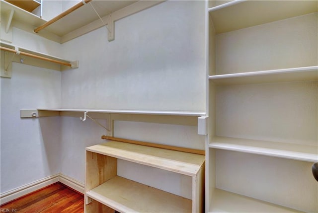 walk in closet featuring hardwood / wood-style flooring