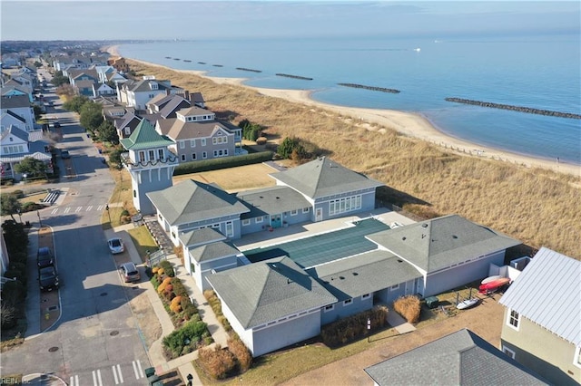 bird's eye view featuring a water view and a view of the beach