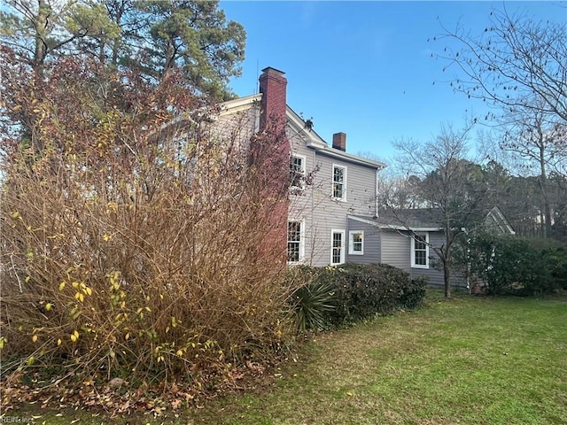 view of property exterior featuring a yard