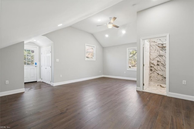 additional living space featuring ceiling fan, vaulted ceiling, and dark hardwood / wood-style flooring