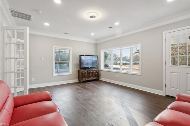 living room featuring ornamental molding and dark hardwood / wood-style floors