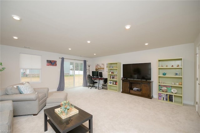 living room featuring light carpet