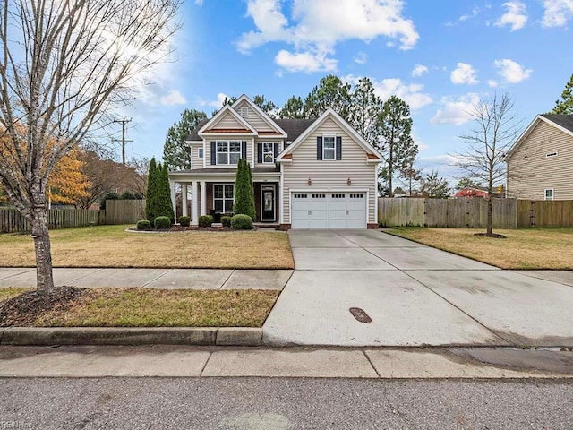 view of front of house featuring a front yard and a garage