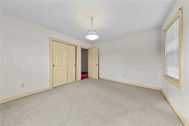 unfurnished bedroom with a closet and carpet