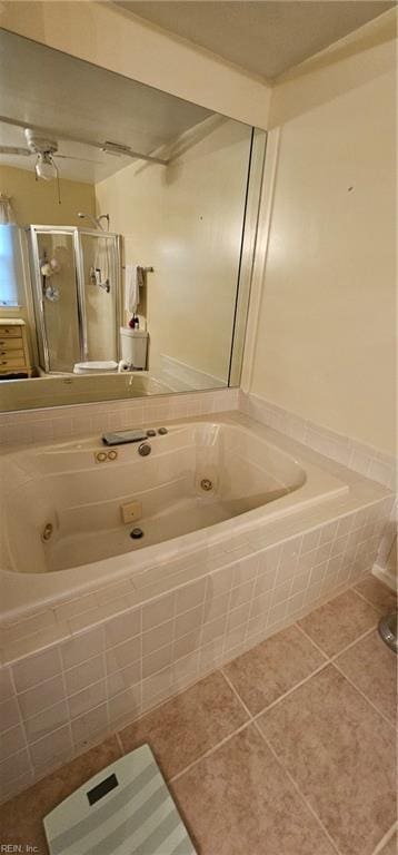 bathroom featuring tile patterned floors and independent shower and bath