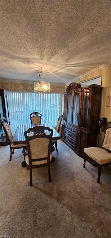 carpeted dining room featuring ornamental molding, a textured ceiling, and an inviting chandelier