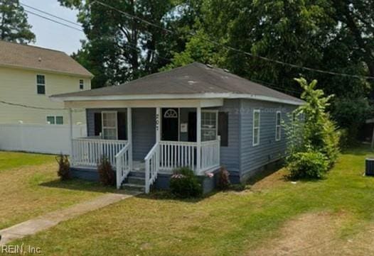 bungalow featuring a front yard and covered porch