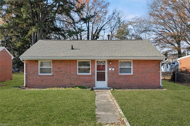 bungalow-style house with a front yard