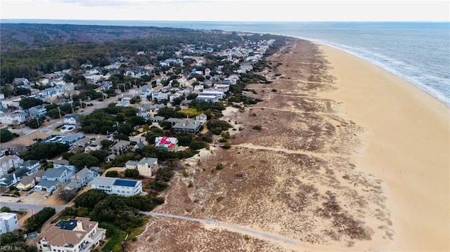 bird's eye view featuring a beach view and a water view