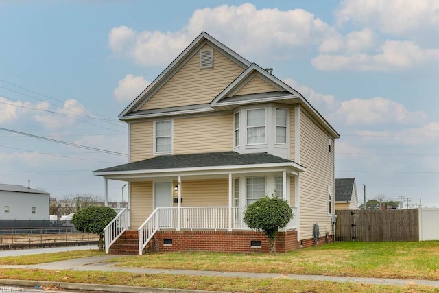 view of front of home featuring a front lawn and a porch