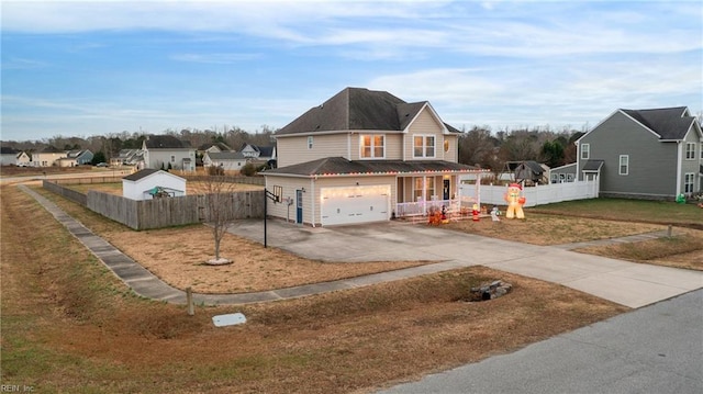 view of front of property featuring a garage and a front lawn