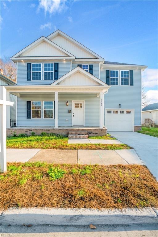 view of front of house with a porch and a garage