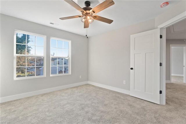 carpeted empty room with ceiling fan