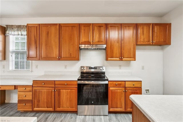 kitchen with light wood-type flooring and stainless steel electric range oven