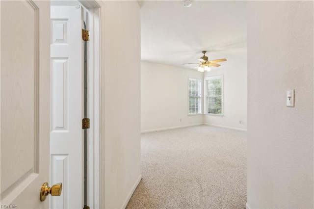 carpeted empty room with ceiling fan