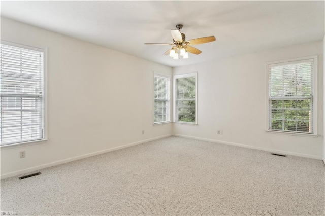 unfurnished room with carpet and ceiling fan