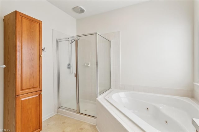 bathroom with tile patterned floors and plus walk in shower