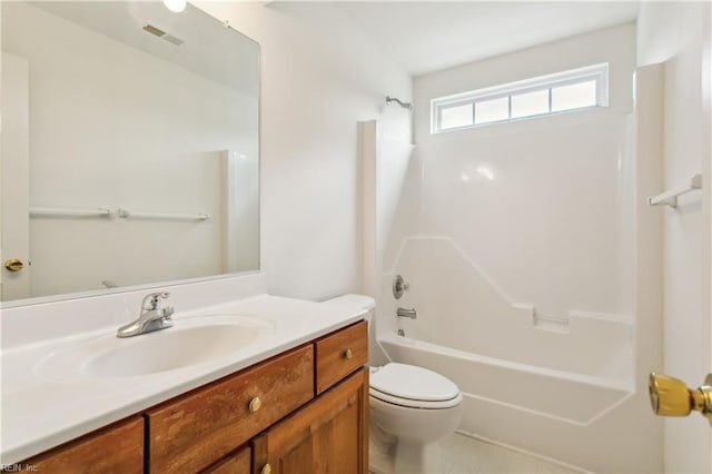 full bathroom with washtub / shower combination, vanity, and toilet