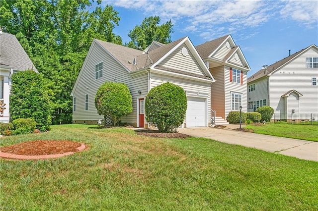 view of front property featuring a front yard and a garage