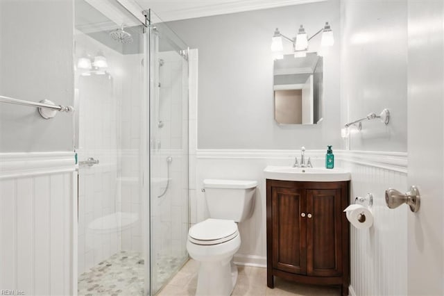 bathroom with tile patterned flooring, vanity, toilet, and walk in shower