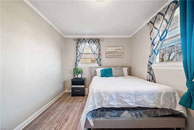 bedroom featuring wood-type flooring and crown molding