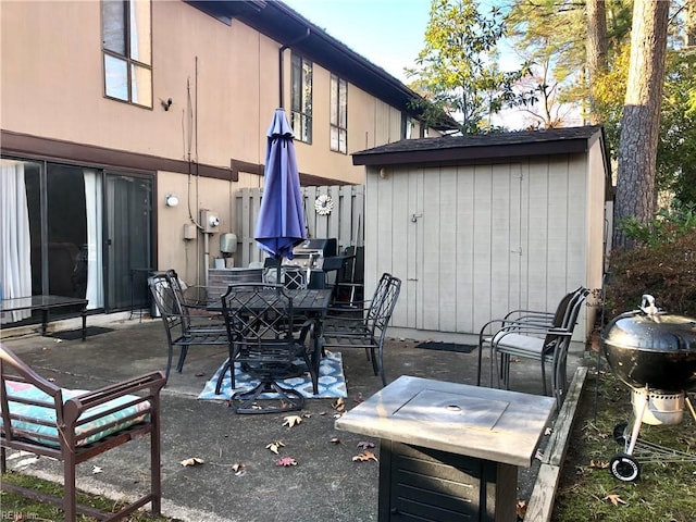 view of patio / terrace featuring a grill and a shed