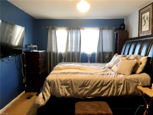 bedroom featuring carpet