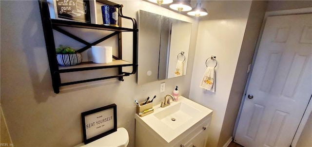 bathroom with vanity and toilet