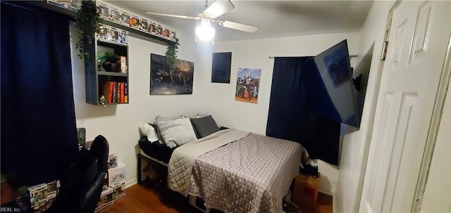 bedroom featuring ceiling fan and dark wood-type flooring