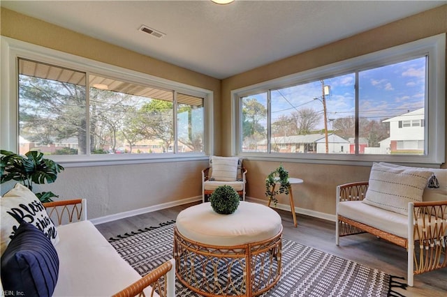 sitting room with hardwood / wood-style floors