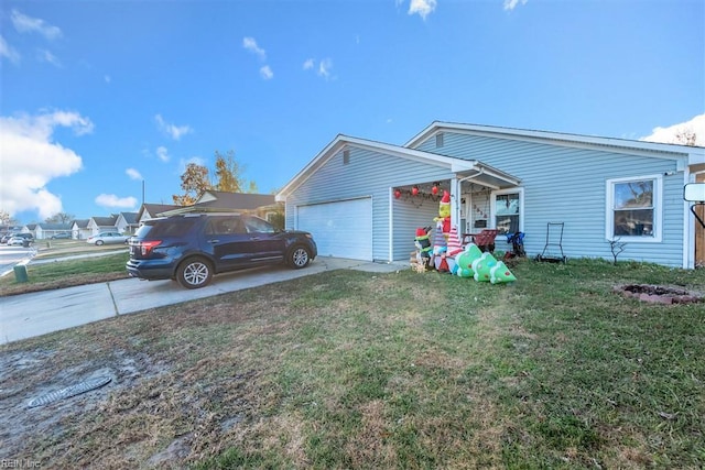 view of front of home with a garage and a front lawn