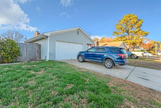 garage featuring a lawn