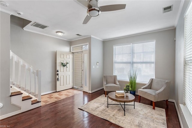 sitting room featuring hardwood / wood-style flooring, ceiling fan, and ornamental molding