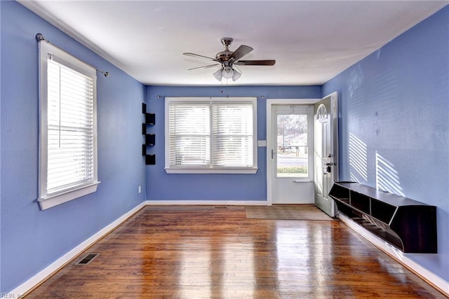 interior space with hardwood / wood-style floors and ceiling fan