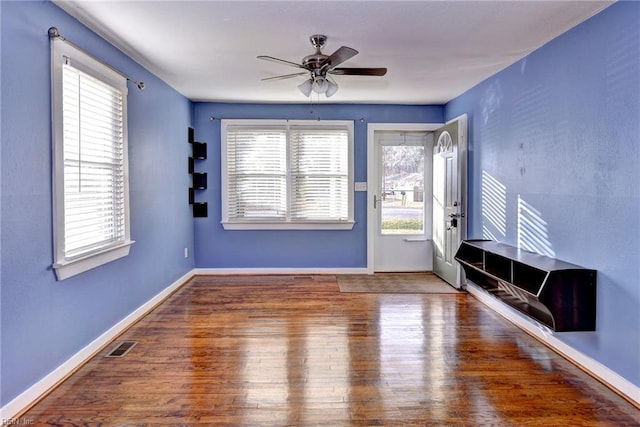 interior space featuring hardwood / wood-style flooring, a wealth of natural light, and ceiling fan