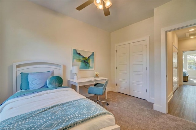 bedroom featuring ceiling fan, a closet, and wood-type flooring